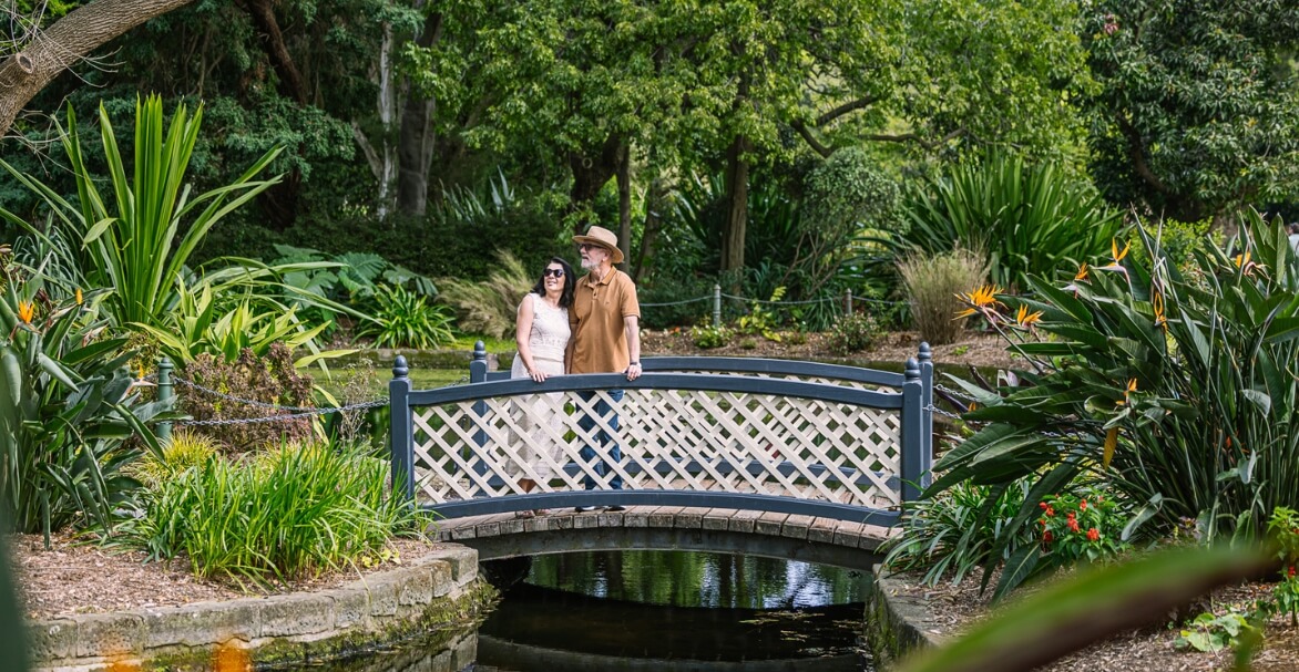 couple on bridge over creek